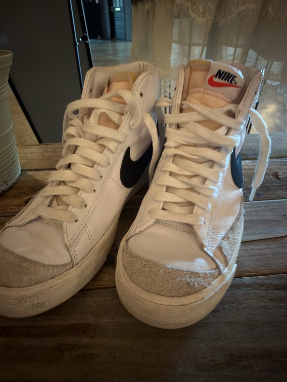 Nike White High-Top Sneakers with Black Swoosh and Cream Accents